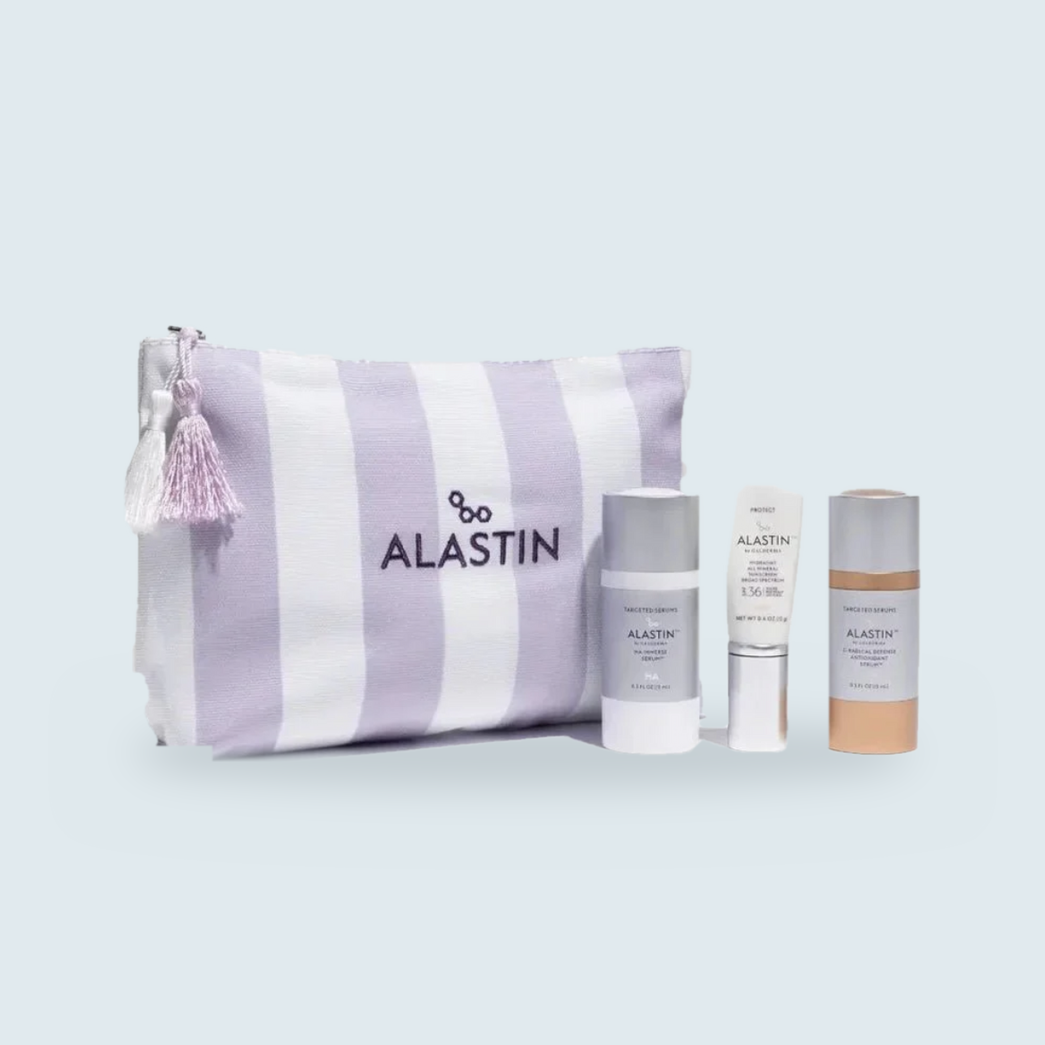 Alastin Skincare Radiance Reset Kit — striped travel bag with HA IMMERSE Serum, C-Radical Defense Antioxidant Serum, and HydraTint Pro Mineral Sunscreen SPF 36 travel sizes
