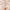 Hydrinity LUXE Lip Hydrator tube with rose gold cap among champagne silk ribbons