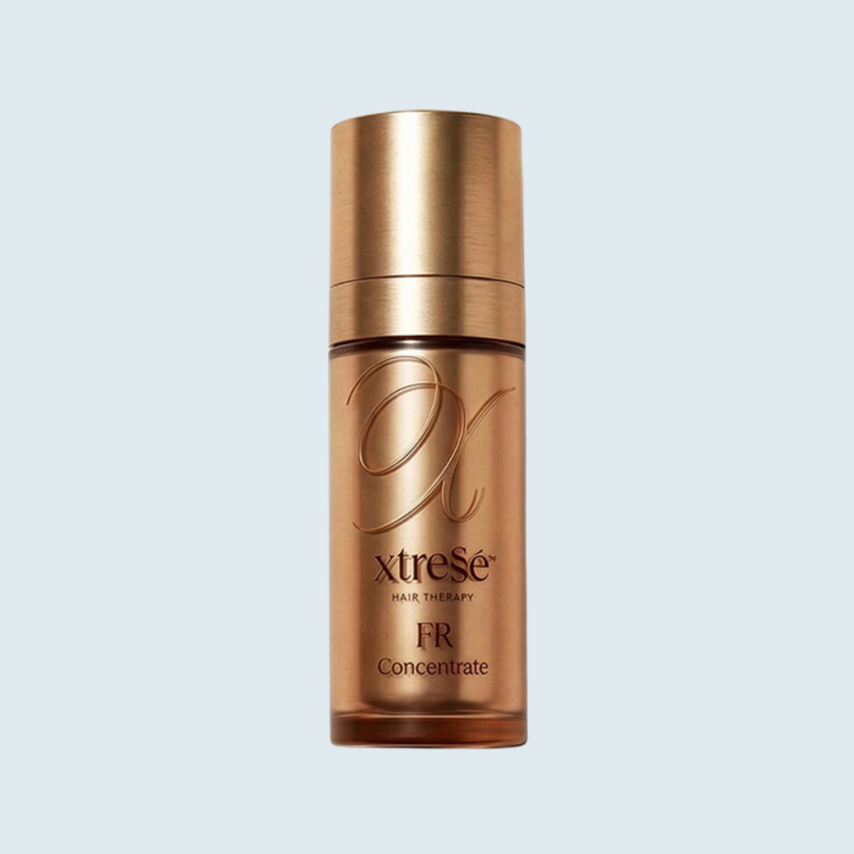 Xtressé FR Concentrate Serum 30 mL pump bottle on a pale blue background