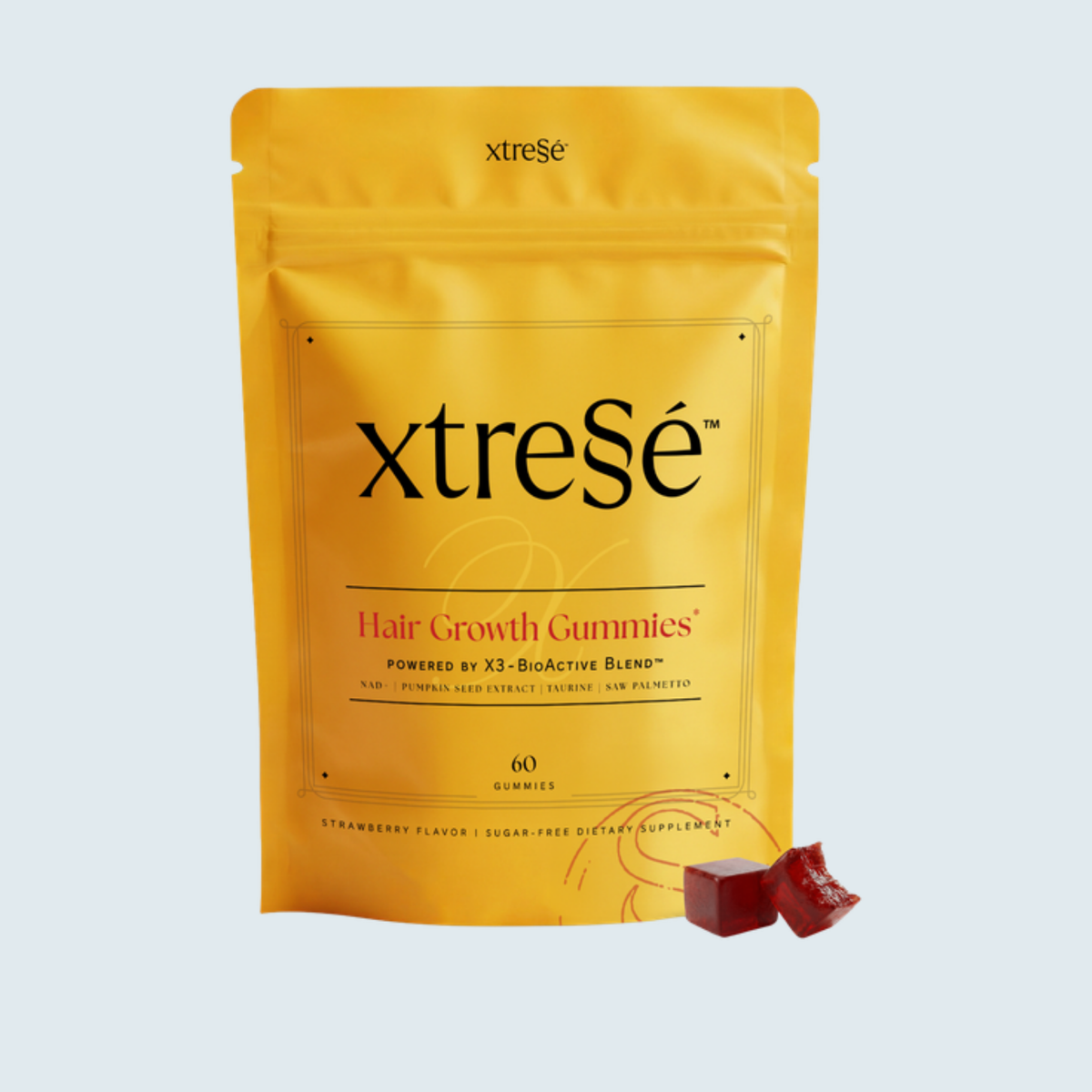 Xtressé Hair Growth Gummies 60 count pouch on a pale blue background